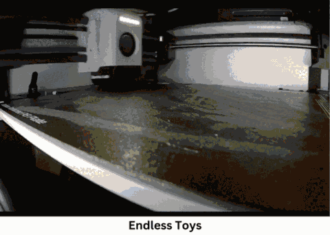A 3D printer finishing a toy character, then the finished toy standing on a table