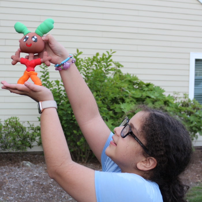 Kid holding printed toy
