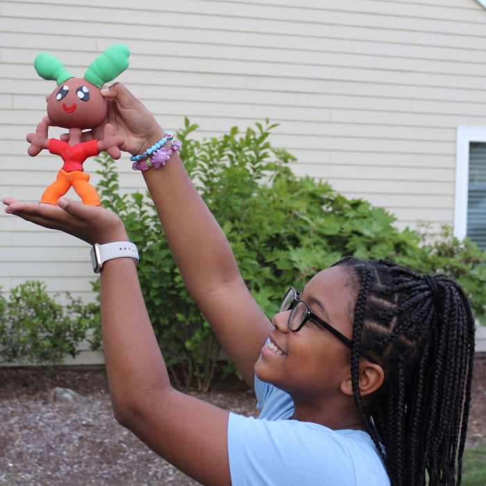 Kid holding printed toy